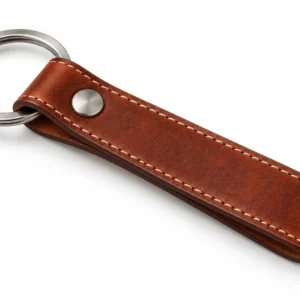 Brown stitched leather keychain with a silver split ring on a white background.